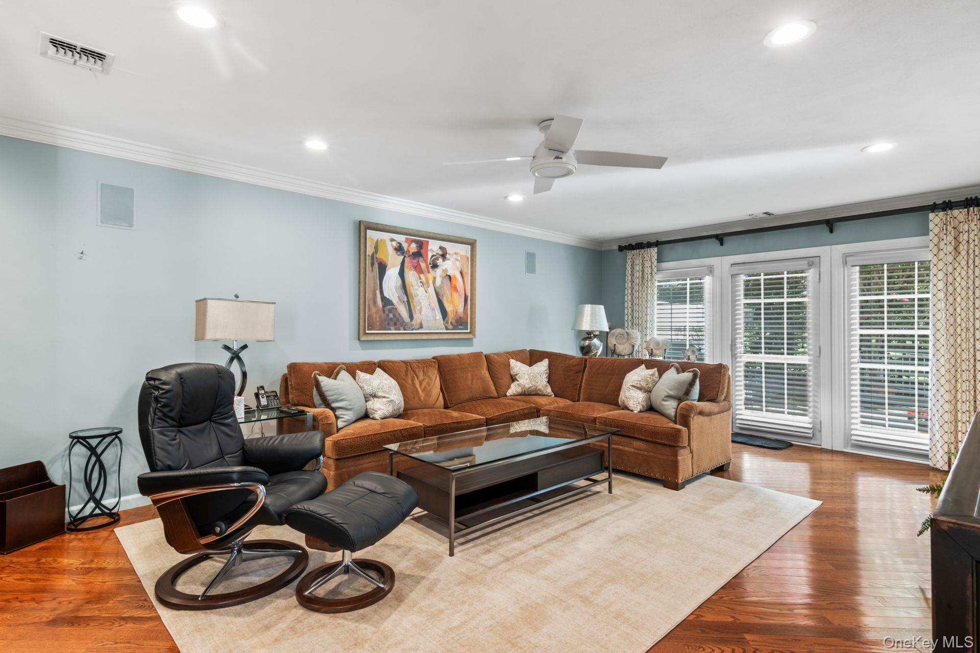 77 The Woods Commack, NY 11725 - Photo 8 of 31 Living room featuring wood finished floors, recessed lighting, crown molding, and ceiling fan