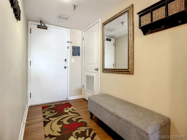 a kitchen with stainless steel appliances granite countertop a refrigerator sink and white cabinets