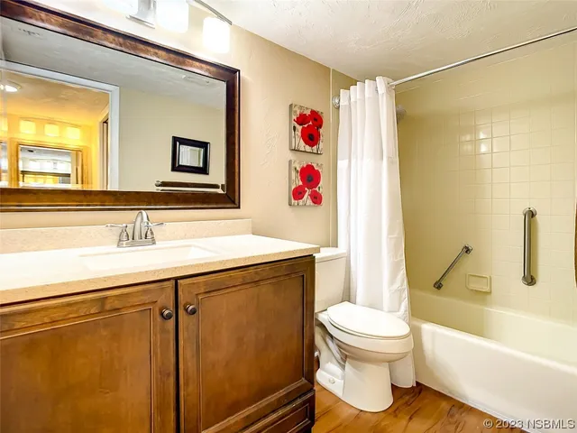 a bedroom with a large bed and a large window