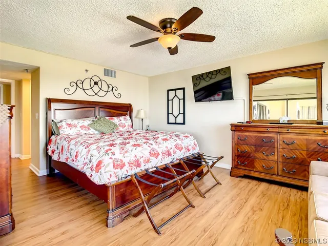 a view of a room with gym equipment and a window