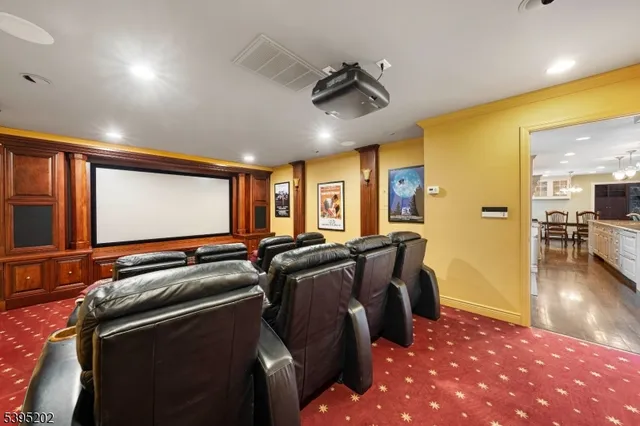 a room with furniture projector and screen