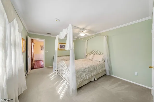 a bedroom with a bed and a large mirror