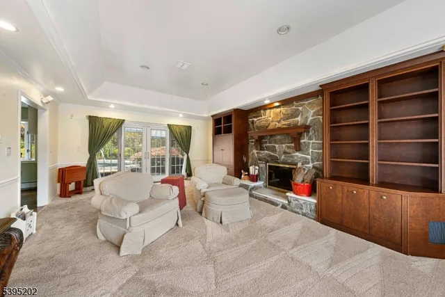 a living room with fireplace furniture and a flat screen tv