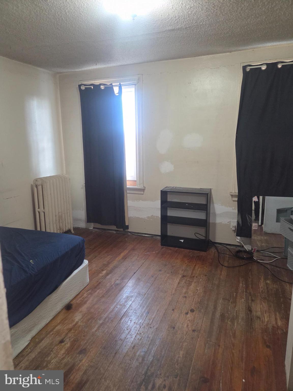 6378 Marsden Street Philadelphia, PA 19135 - Photo 13 of 24 a living room with furniture and a lamp