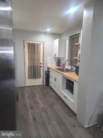 a view of a kitchen with sink and dishwasher