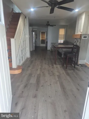 a view of livingroom with furniture and staircase