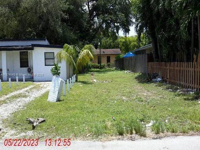 a view of a backyard with a garden and plants