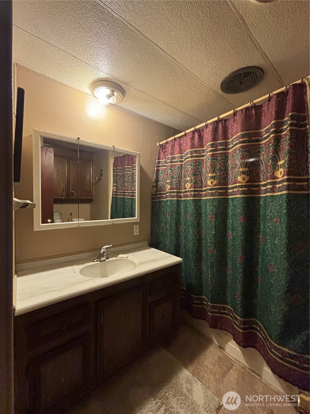 1841 Trosper Road Southwest, Unit 60 Tumwater, WA 98512 - Photo 11 of 18 a bathroom with a sink and a mirror
