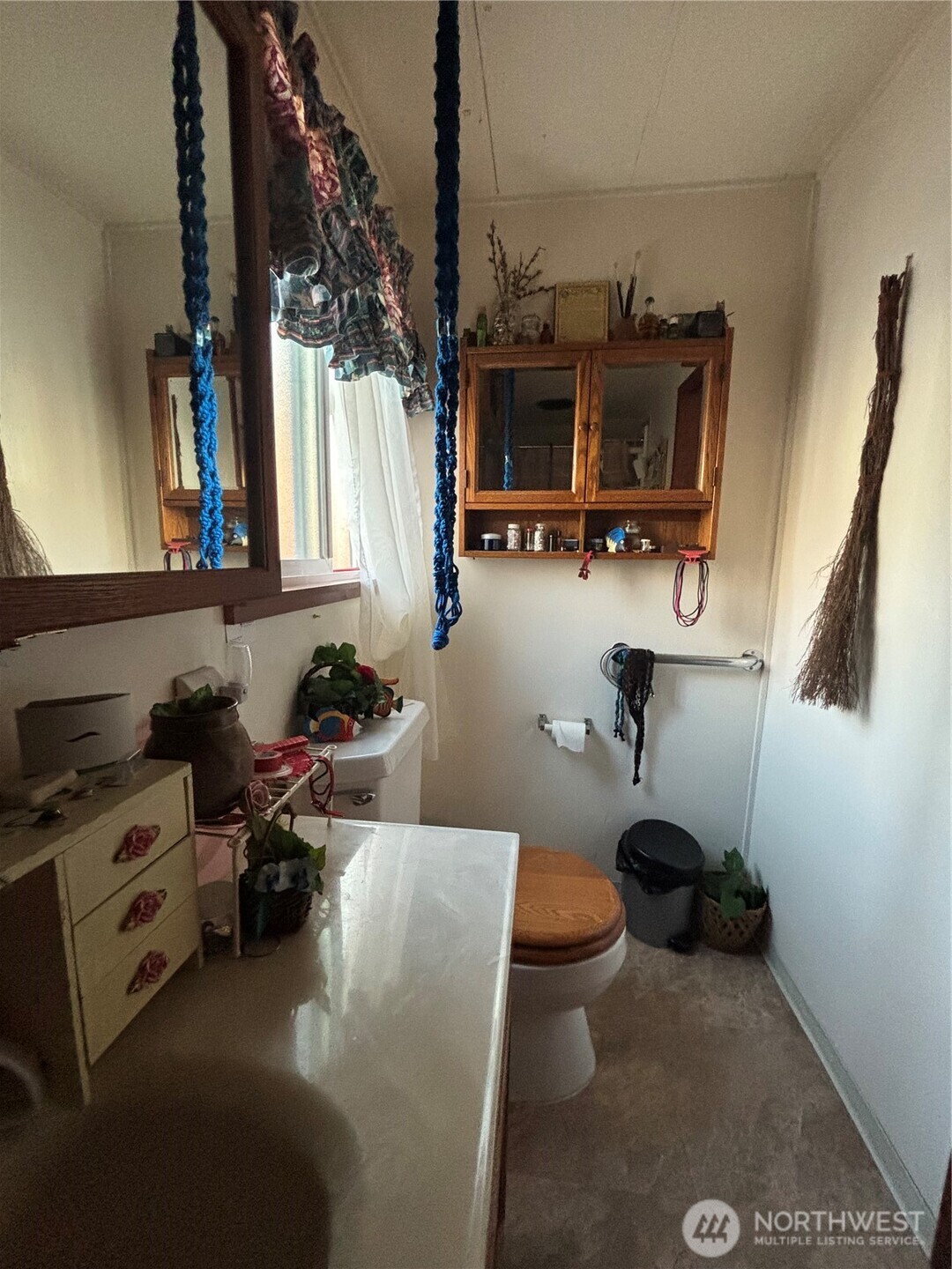 1841 Trosper Road Southwest, Unit 60 Tumwater, WA 98512 - Photo 13 of 18 a kitchen with a sink and a stove next to a window