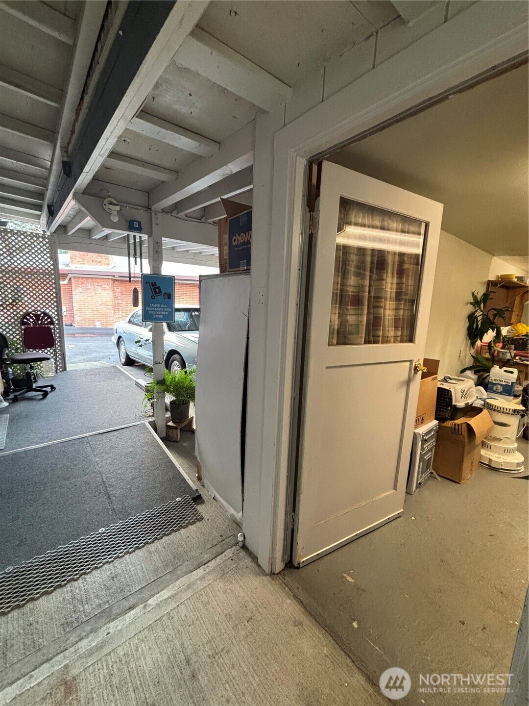 1841 Trosper Road Southwest, Unit 60 Tumwater, WA 98512 - Photo 17 of 18 a view of a porch with furniture and a garage