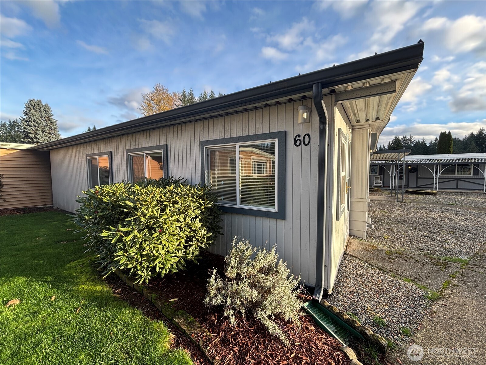 1841 Trosper Road Southwest, Unit 60 Tumwater, WA 98512 - Photo 2 of 18 a front view of a house with garden