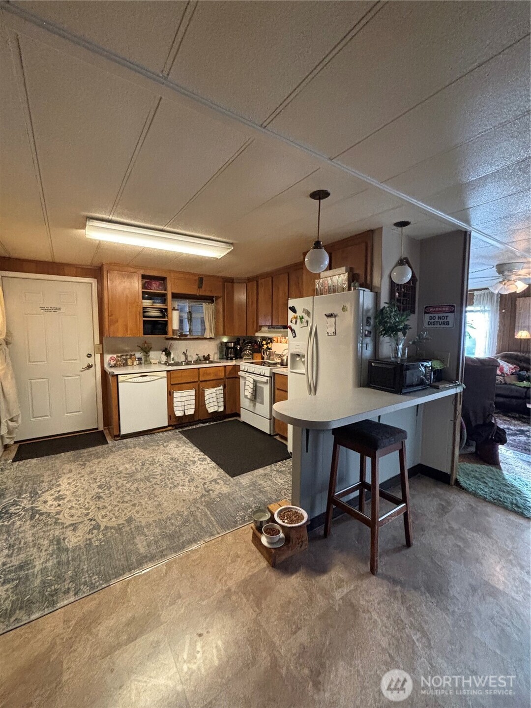 1841 Trosper Road Southwest, Unit 60 Tumwater, WA 98512 - Photo 4 of 18 a living room with furniture and kitchen view