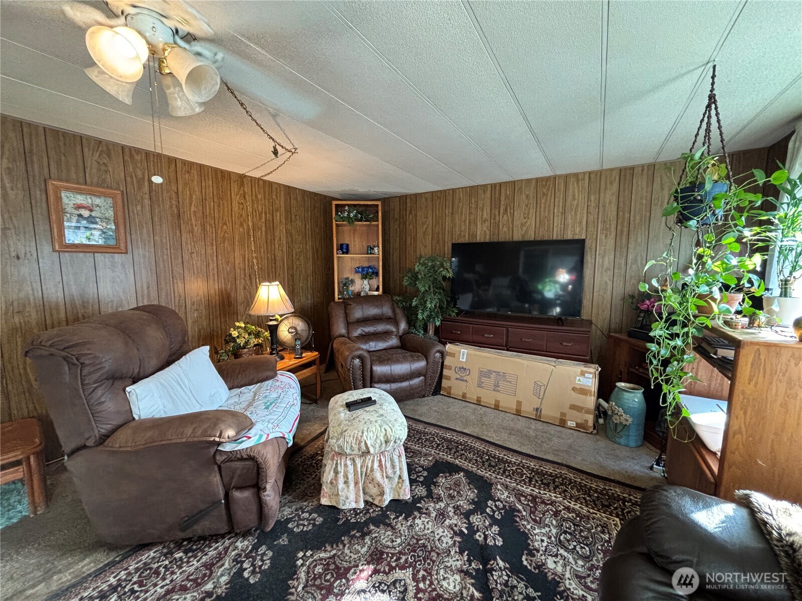 1841 Trosper Road Southwest, Unit 60 Tumwater, WA 98512 - Photo 5 of 18 a living room with furniture and a flat screen tv
