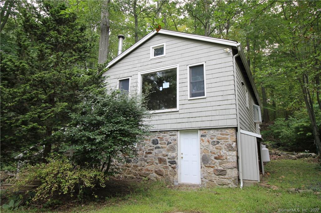 94 Mountain Road Ridgefield, CT 06877 - Photo 1 of 1 a view of a house with a yard