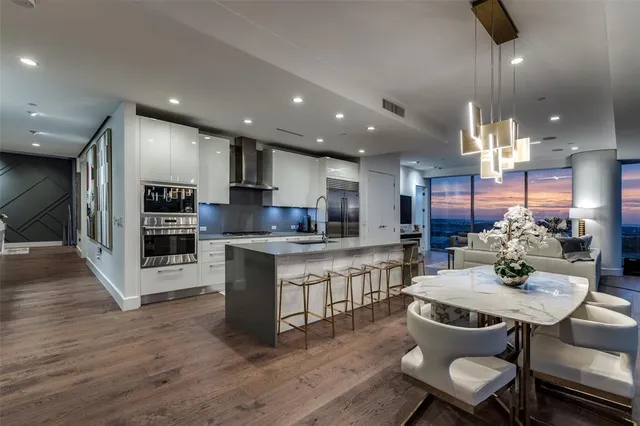 a kitchen with a table and chairs in it