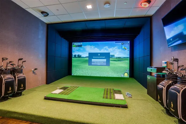 a room with pool table and a large window