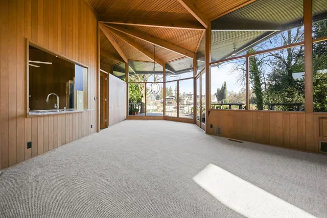 a kitchen with stainless steel appliances granite countertop wooden cabinets and sink