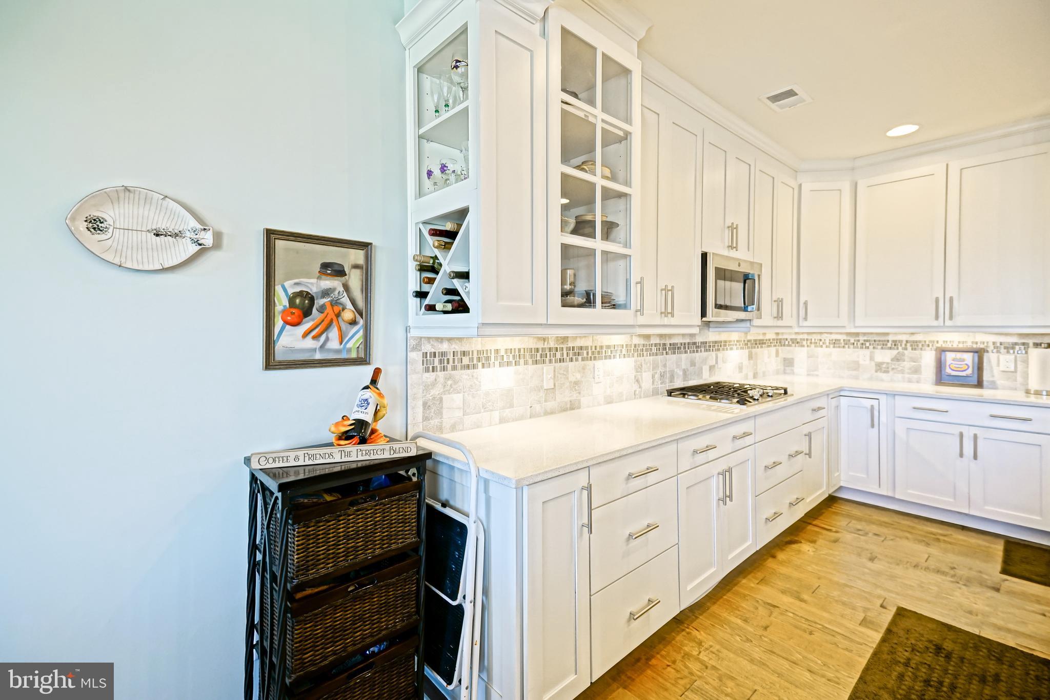 31301 Temple Road Lewes, DE 19958 - Photo 11 of 64 a kitchen with stainless steel appliances granite countertop a stove and a sink