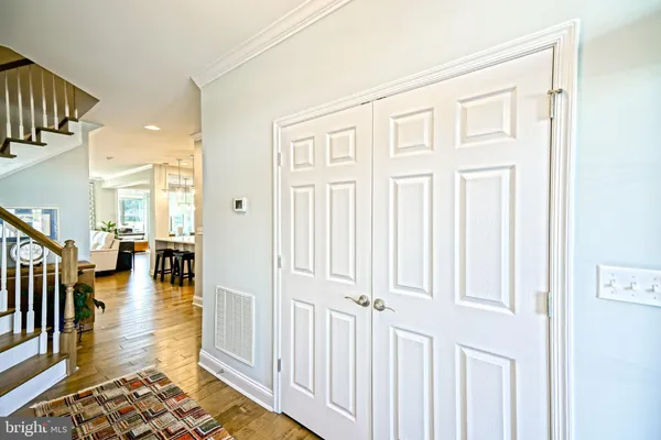 a view of entryway with wooden floor