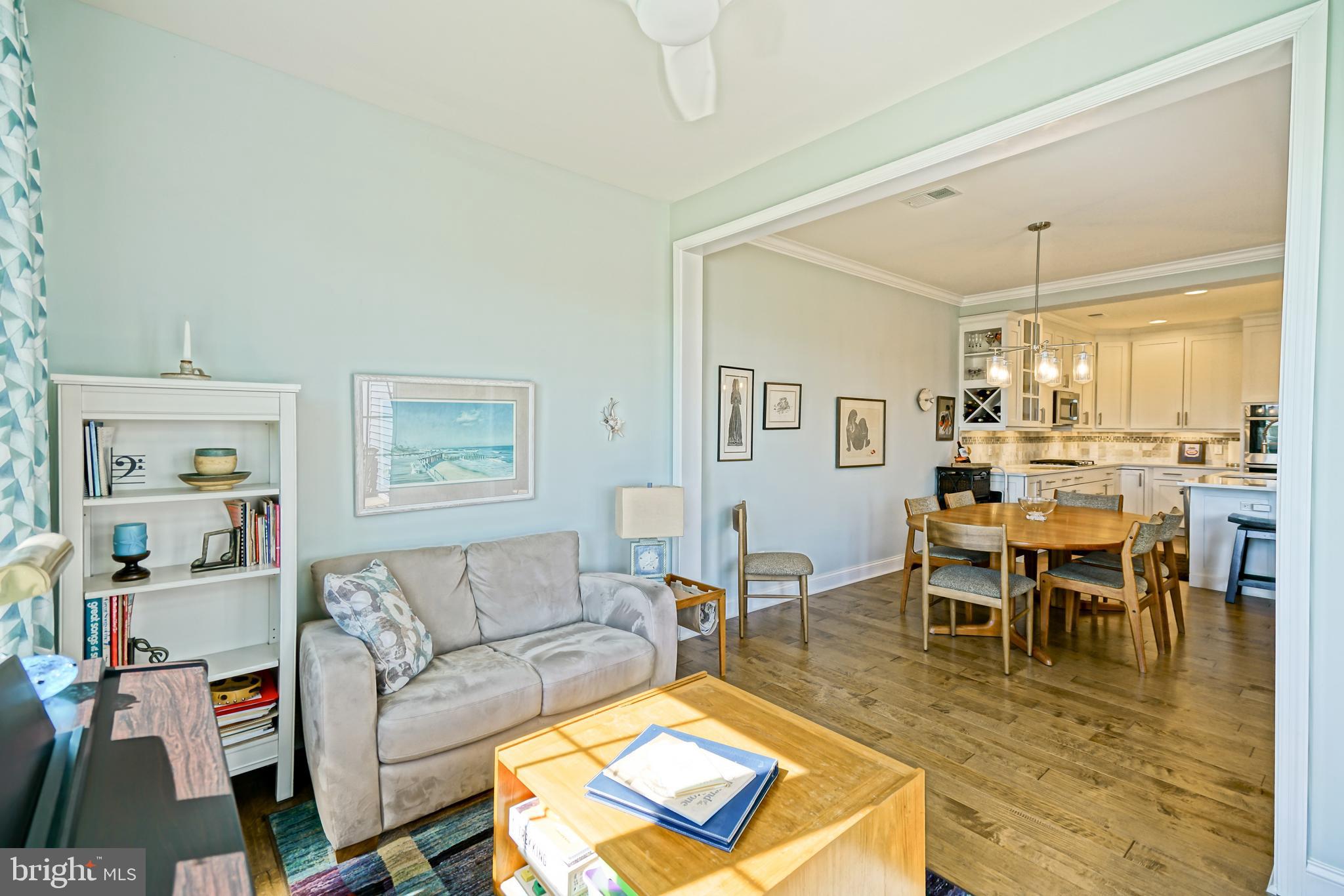 31301 Temple Road Lewes, DE 19958 - Photo 23 of 64 a living room with furniture wooden floor and a dining table