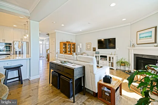 a spacious bedroom with a bed and wooden floor