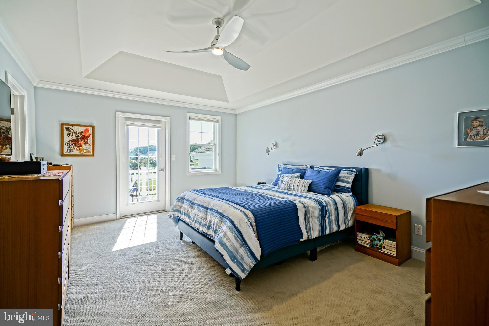 31301 Temple Road Lewes, DE 19958 - Photo 27 of 64 a spacious bedroom with a bed and wooden floor