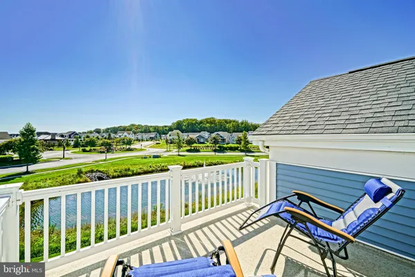 a living room with a couch and a bookshelf