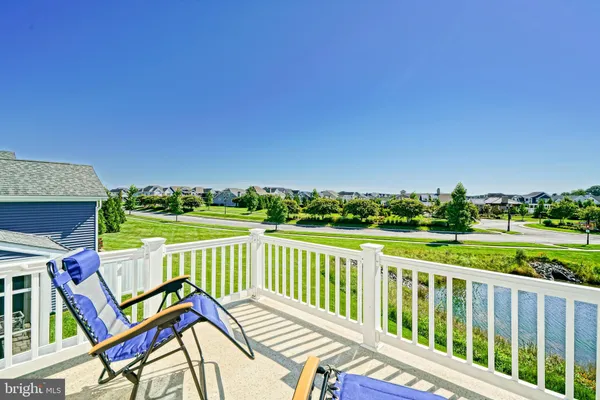 a bedroom with furniture and a book shelf
