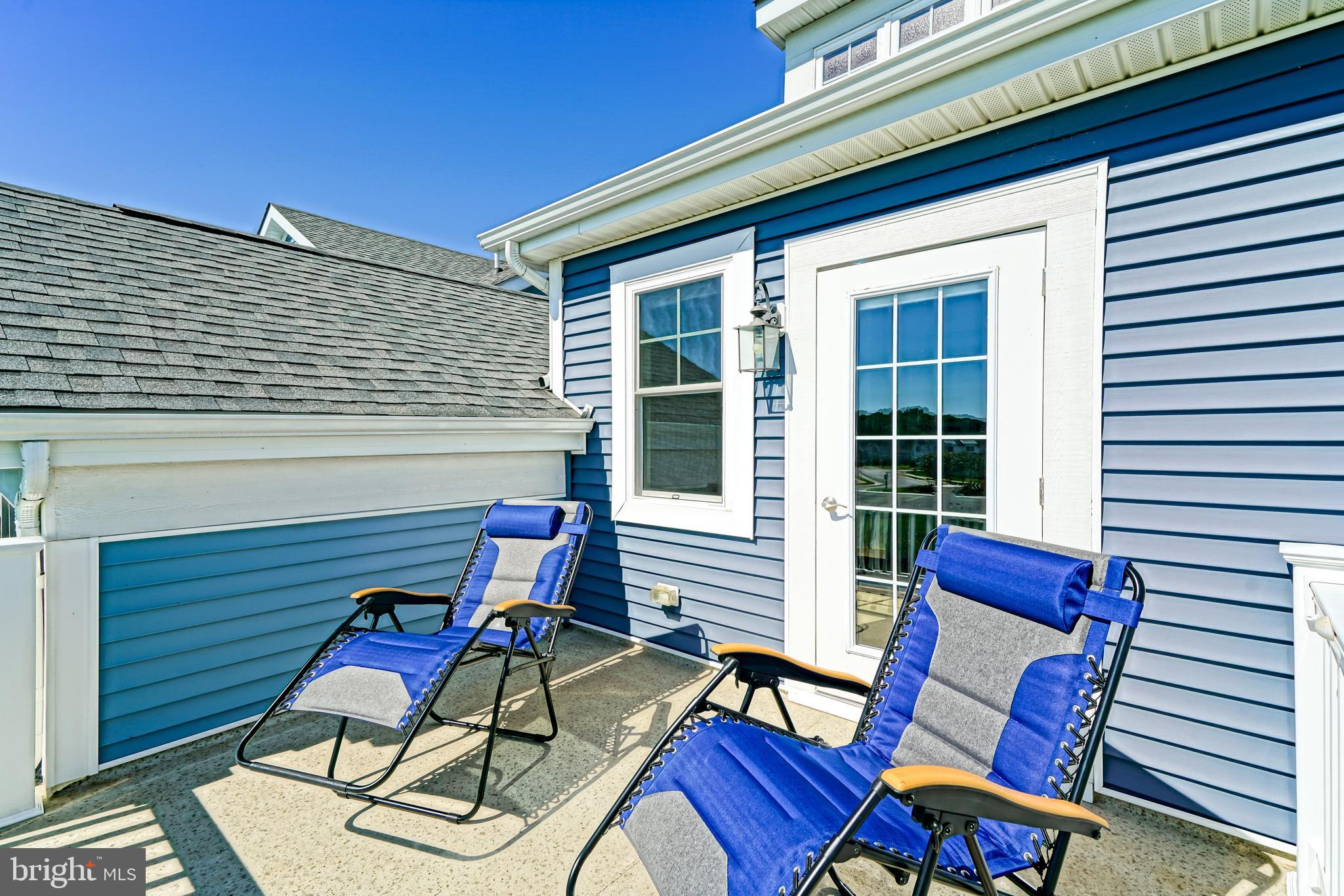 31301 Temple Road Lewes, DE 19958 - Photo 36 of 64 a view of a chairs and table in the balcony