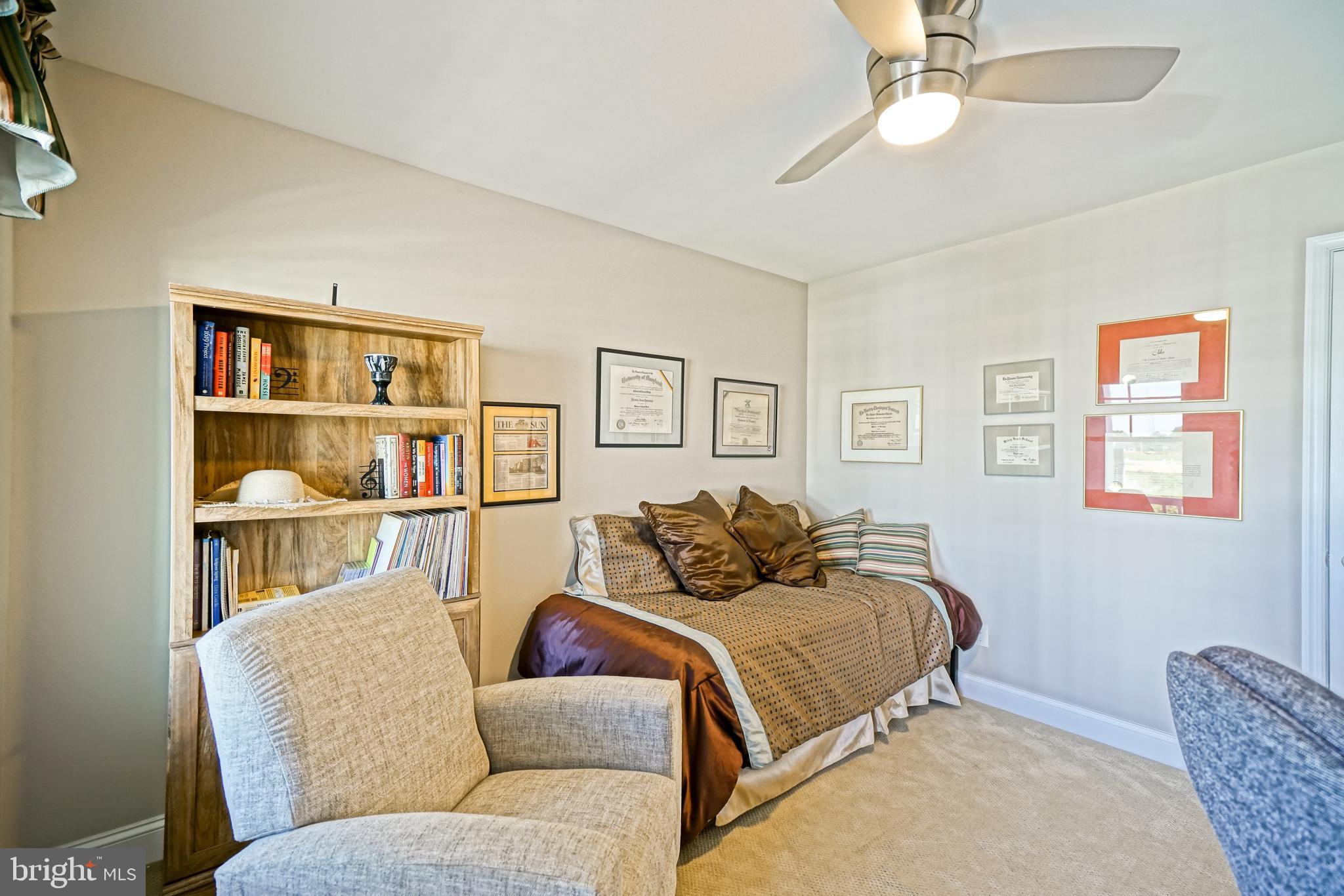 31301 Temple Road Lewes, DE 19958 - Photo 40 of 64 a living room with a couch and a bookshelf