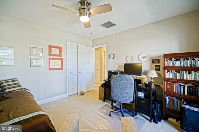 a view of a patio with table and chairs and potted plants