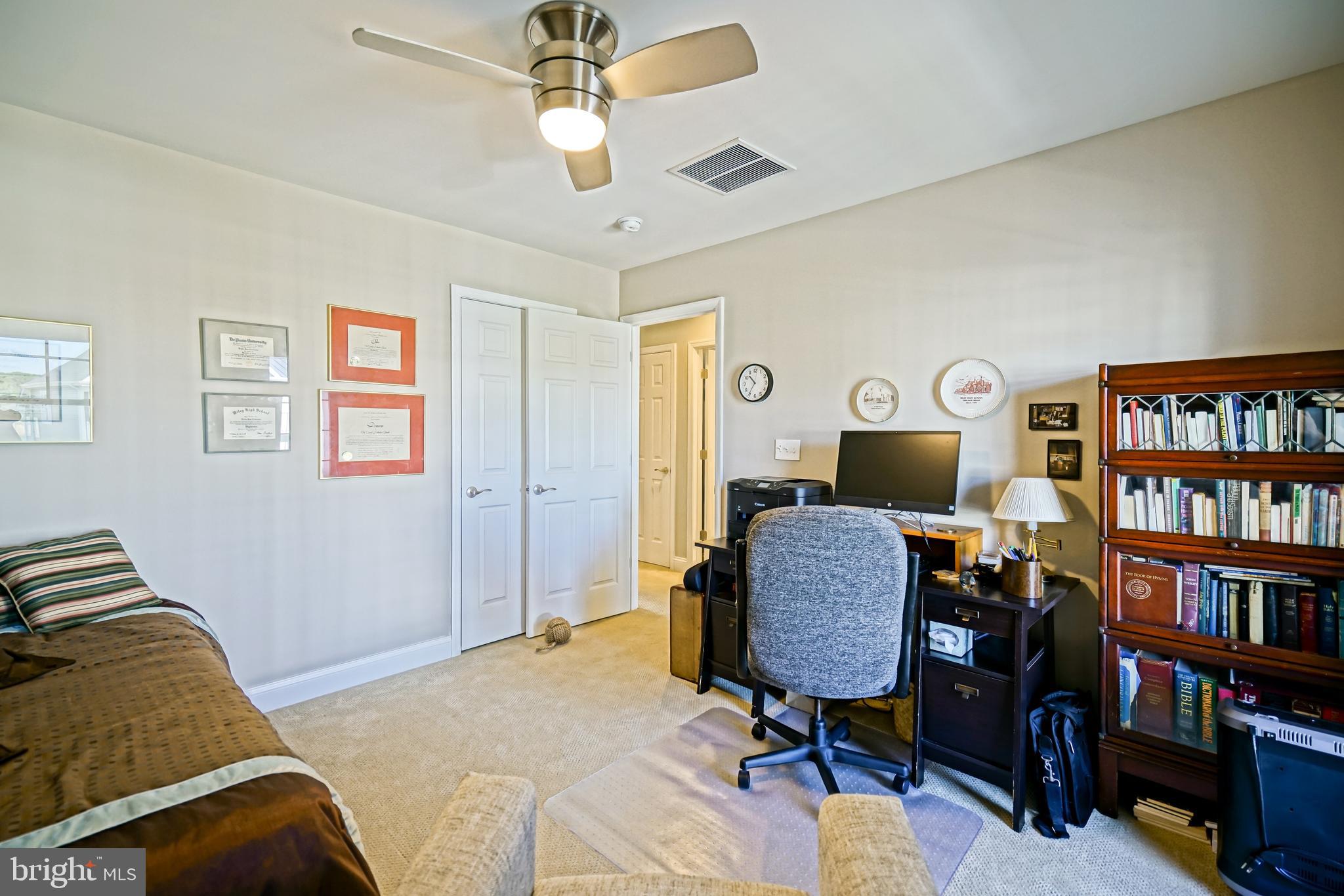 31301 Temple Road Lewes, DE 19958 - Photo 41 of 64 a bedroom with furniture and a book shelf