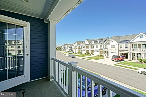 a front view of a house with a yard table and chairs