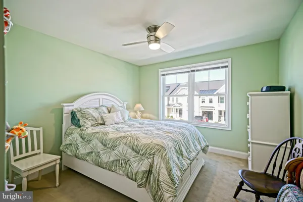 a front view of a residential apartment building with a yard