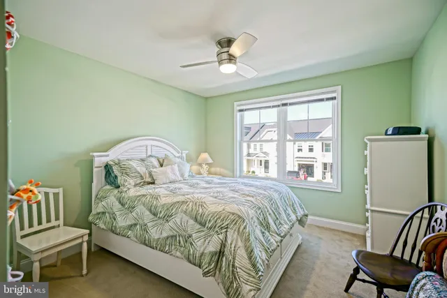 a front view of a residential apartment building with a yard