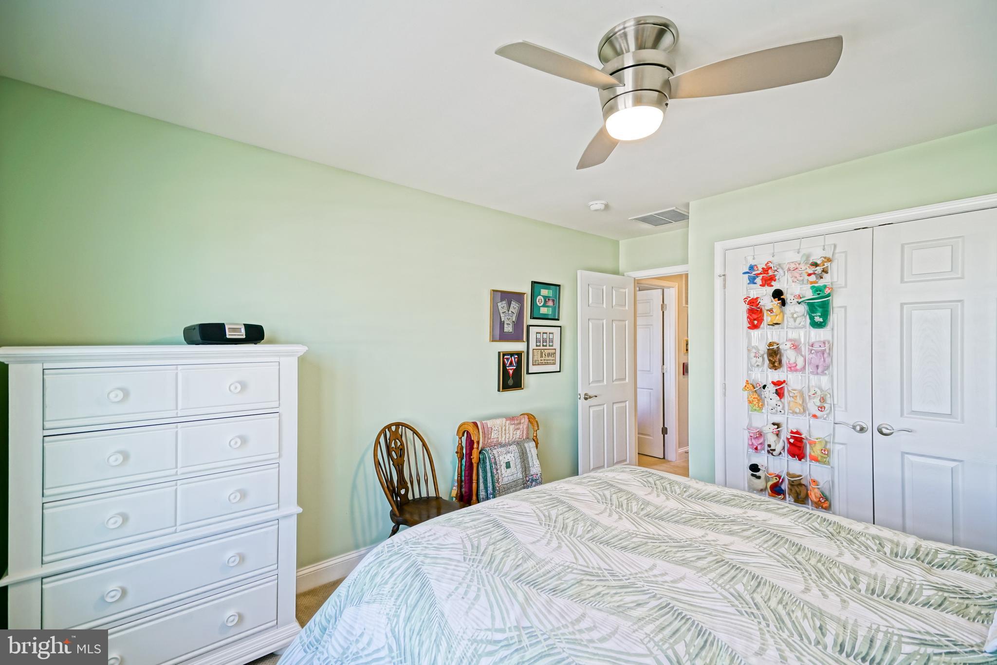 31301 Temple Road Lewes, DE 19958 - Photo 48 of 64 a bedroom with a bed and a dresser
