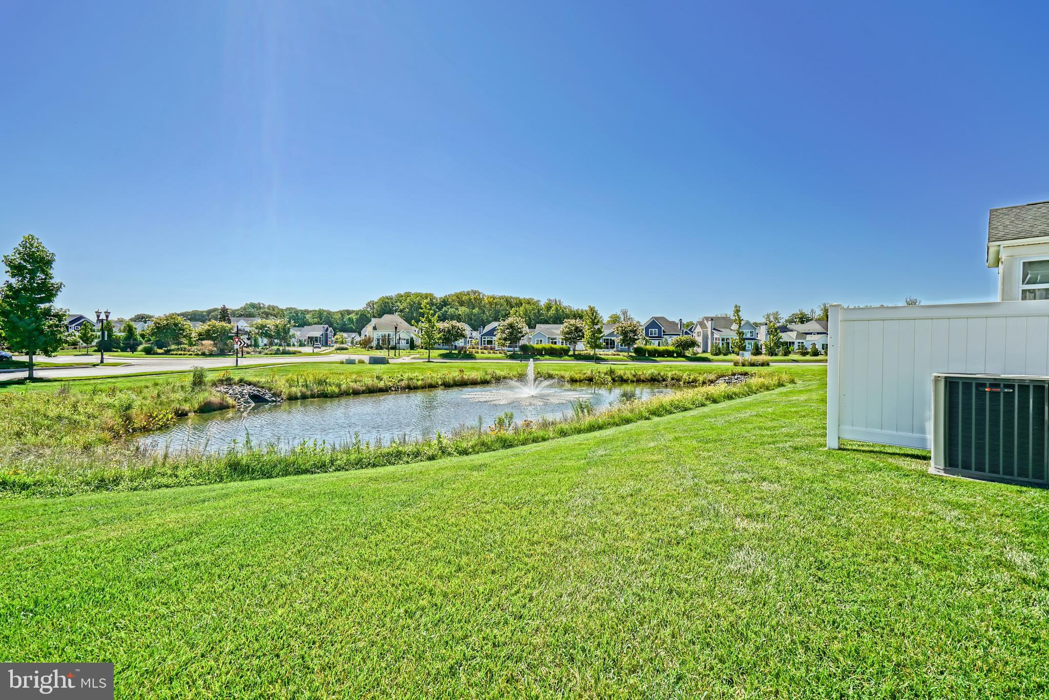 31301 Temple Road Lewes, DE 19958 - Photo 52 of 64 a view of a lake with houses in the back