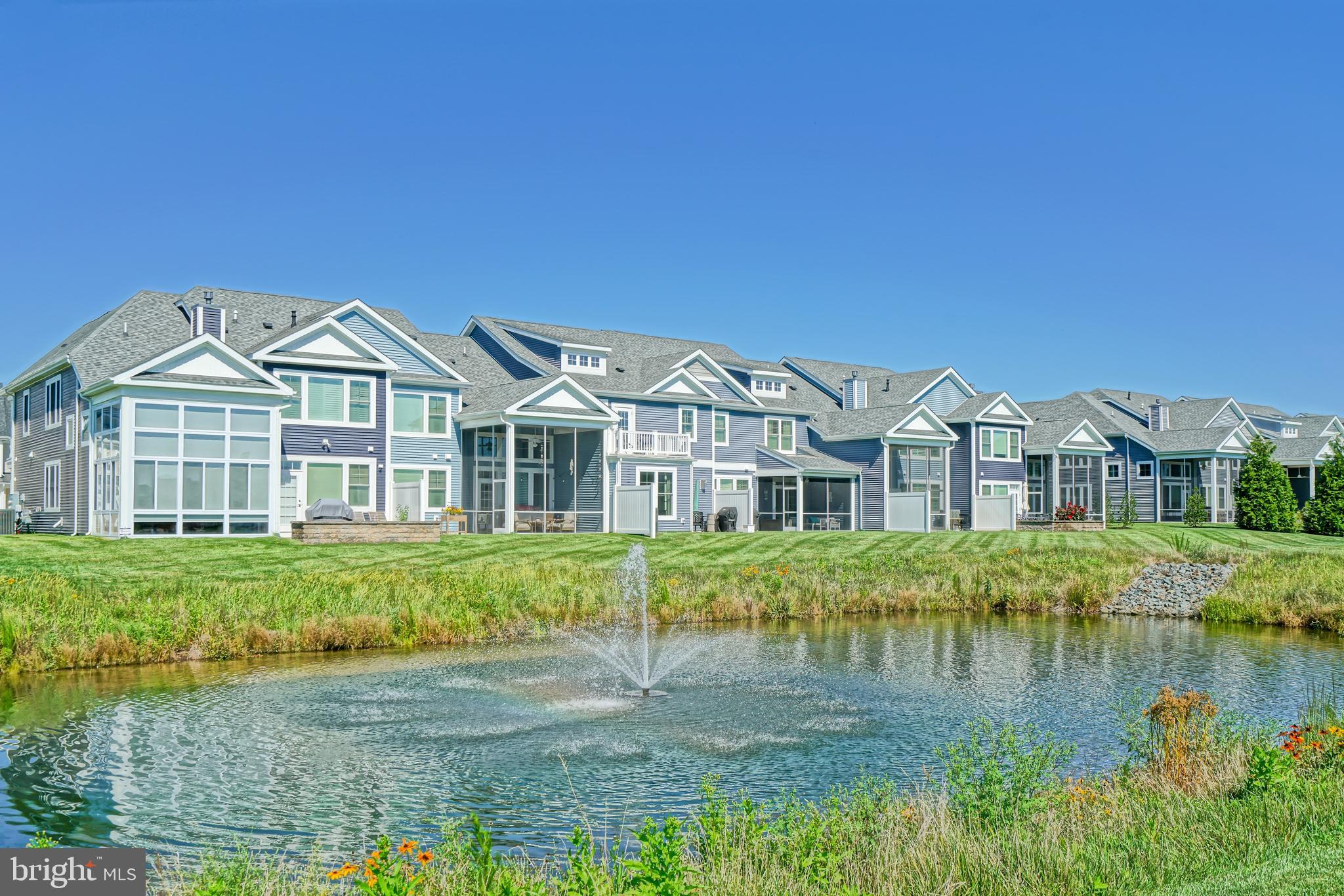 31301 Temple Road Lewes, DE 19958 - Photo 54 of 64 a front view of a house with a yard