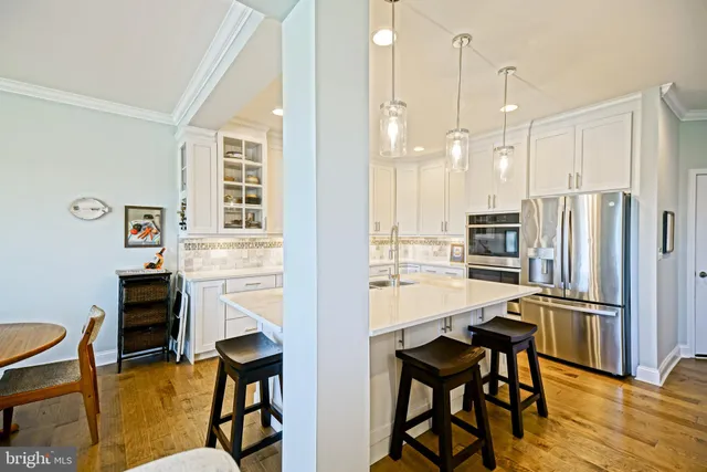 a kitchen with stainless steel appliances granite countertop a stove and a sink