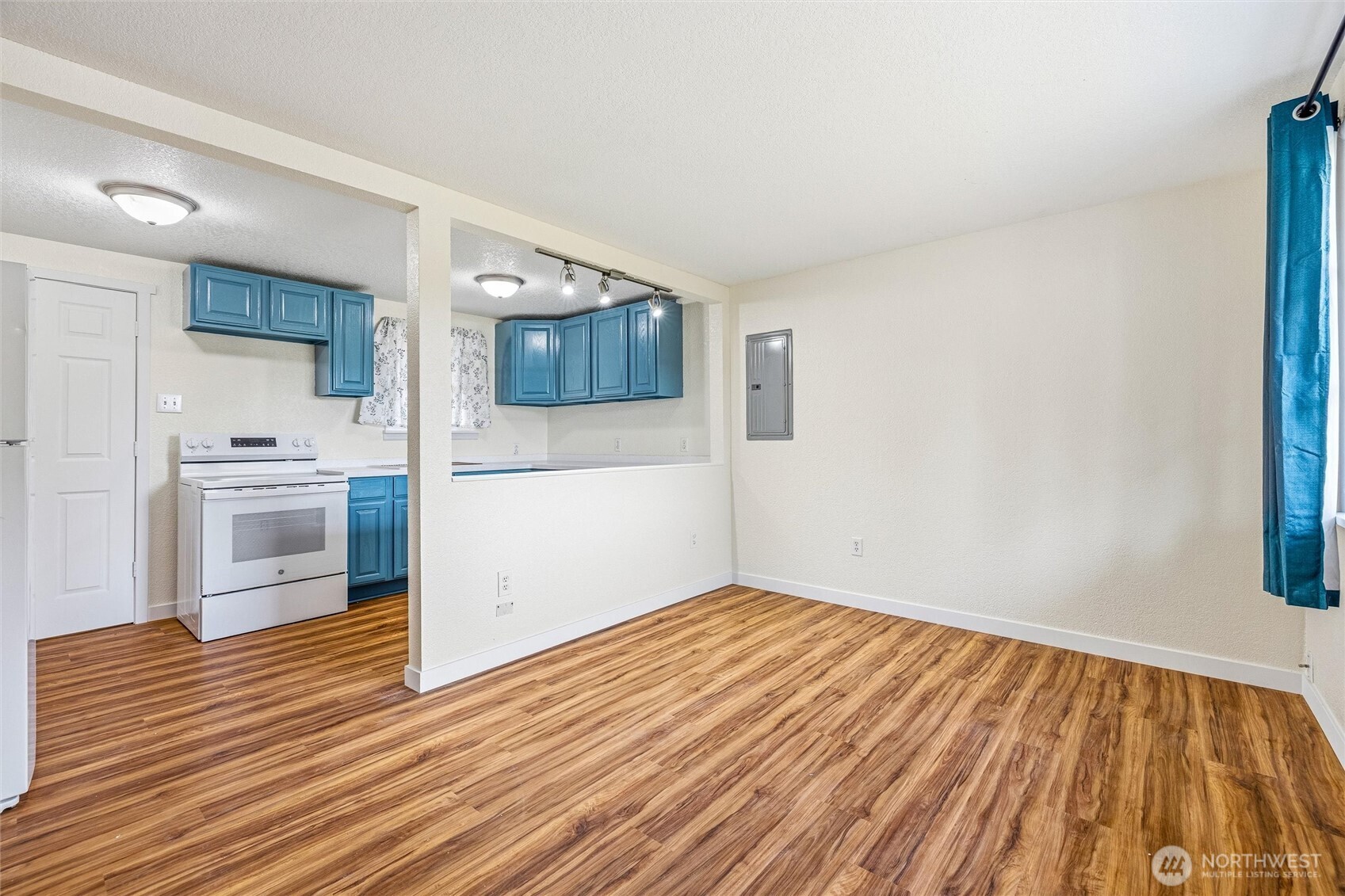 113 South Gardner Road Burlington, WA 98233 - Photo 33 of 40 a view of a kitchen cabinets and wooden floor