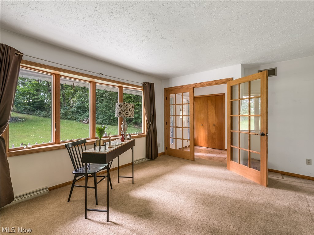 12003 Clinton Road Doylestown, OH 44230 - Photo 4 of 34 Enjoy the wall of windows for an abundance of natural light