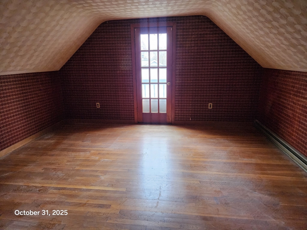 7 Pine Hill Road Grafton, MA 01560 - Photo 11 of 18 a view of an empty room with wooden floor and a window
