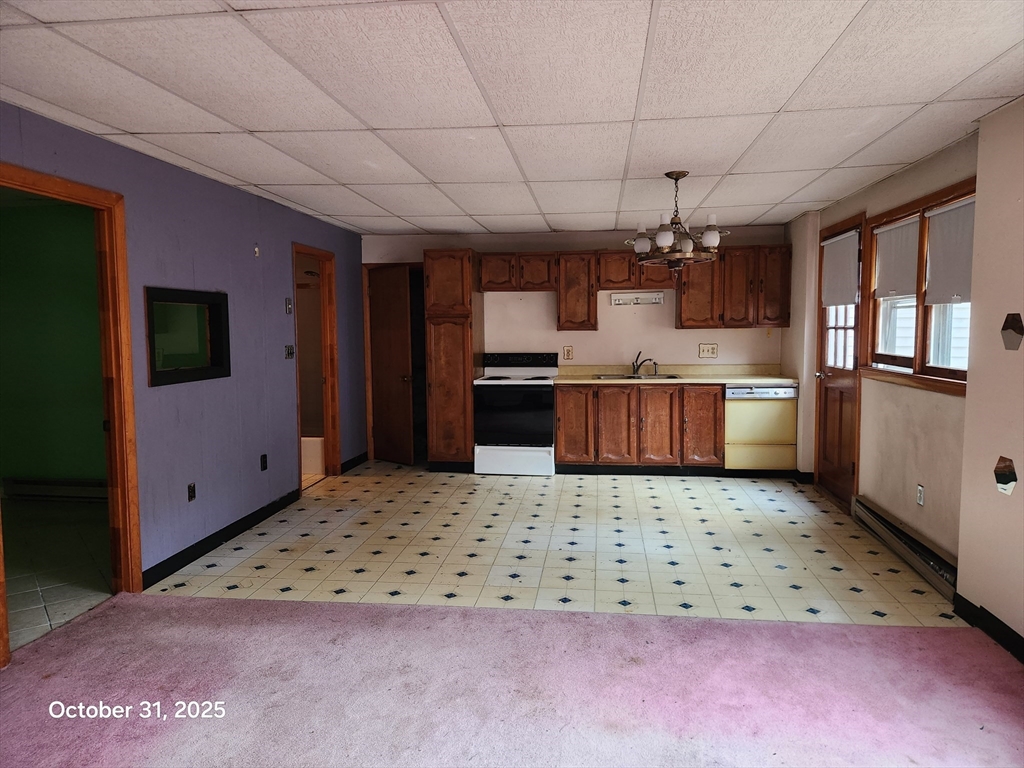7 Pine Hill Road Grafton, MA 01560 - Photo 12 of 18 a kitchen with stainless steel appliances granite countertop a sink stove and refrigerator