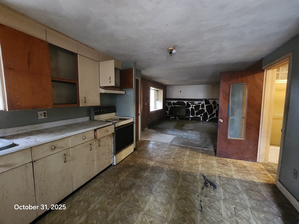 7 Pine Hill Road Grafton, MA 01560 - Photo 14 of 18 a large kitchen with a large window and stainless steel appliances