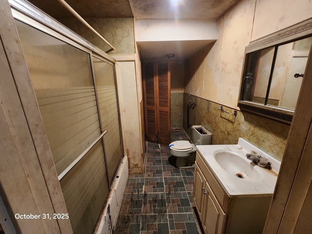 7 Pine Hill Road Grafton, MA 01560 - Photo 16 of 18 a bathroom with a sink a toilet a mirror and shower