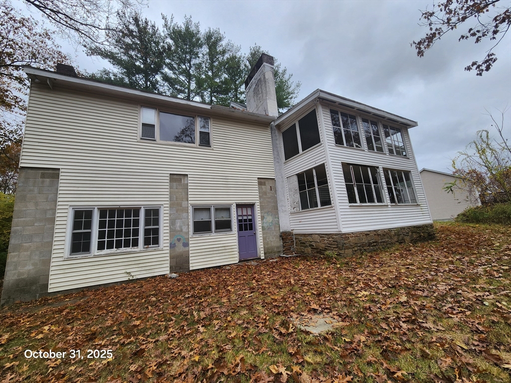 7 Pine Hill Road Grafton, MA 01560 - Photo 2 of 18 a house view with a garden space