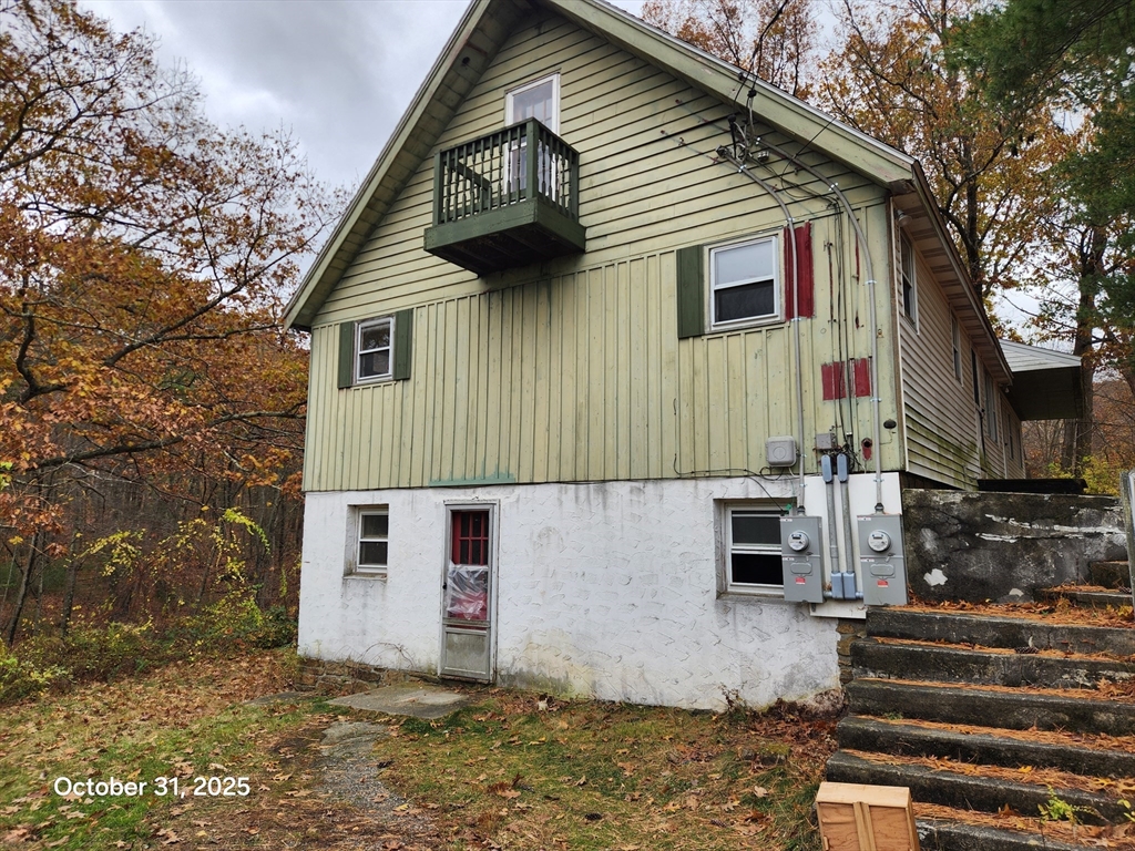 7 Pine Hill Road Grafton, MA 01560 - Photo 3 of 18 a front view of a house with a tree