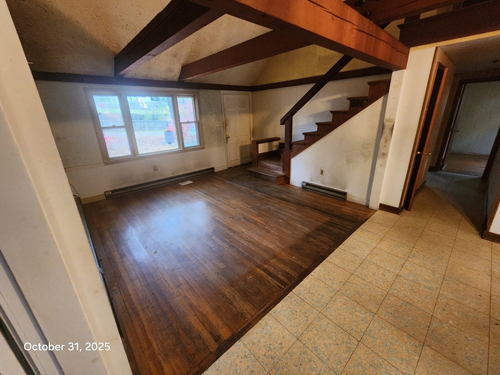 7 Pine Hill Road Grafton, MA 01560 - Photo 6 of 18 a view of an empty room with wooden floor and a window