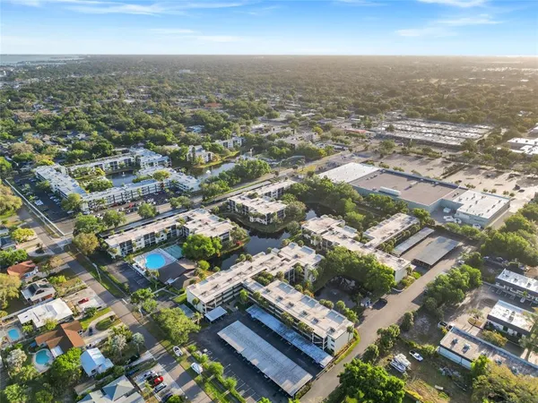 an aerial view of residential houses with city view