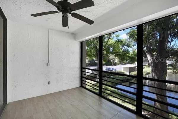 a view of a room with wooden floor and outdoor space